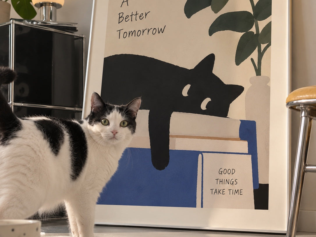Playful cat wall art styled in a bright modern interior