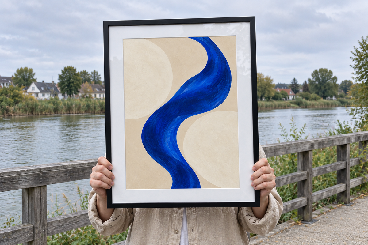 Illustrative outdoor lifestyle scene of a person holding framed Blue Interval artwork